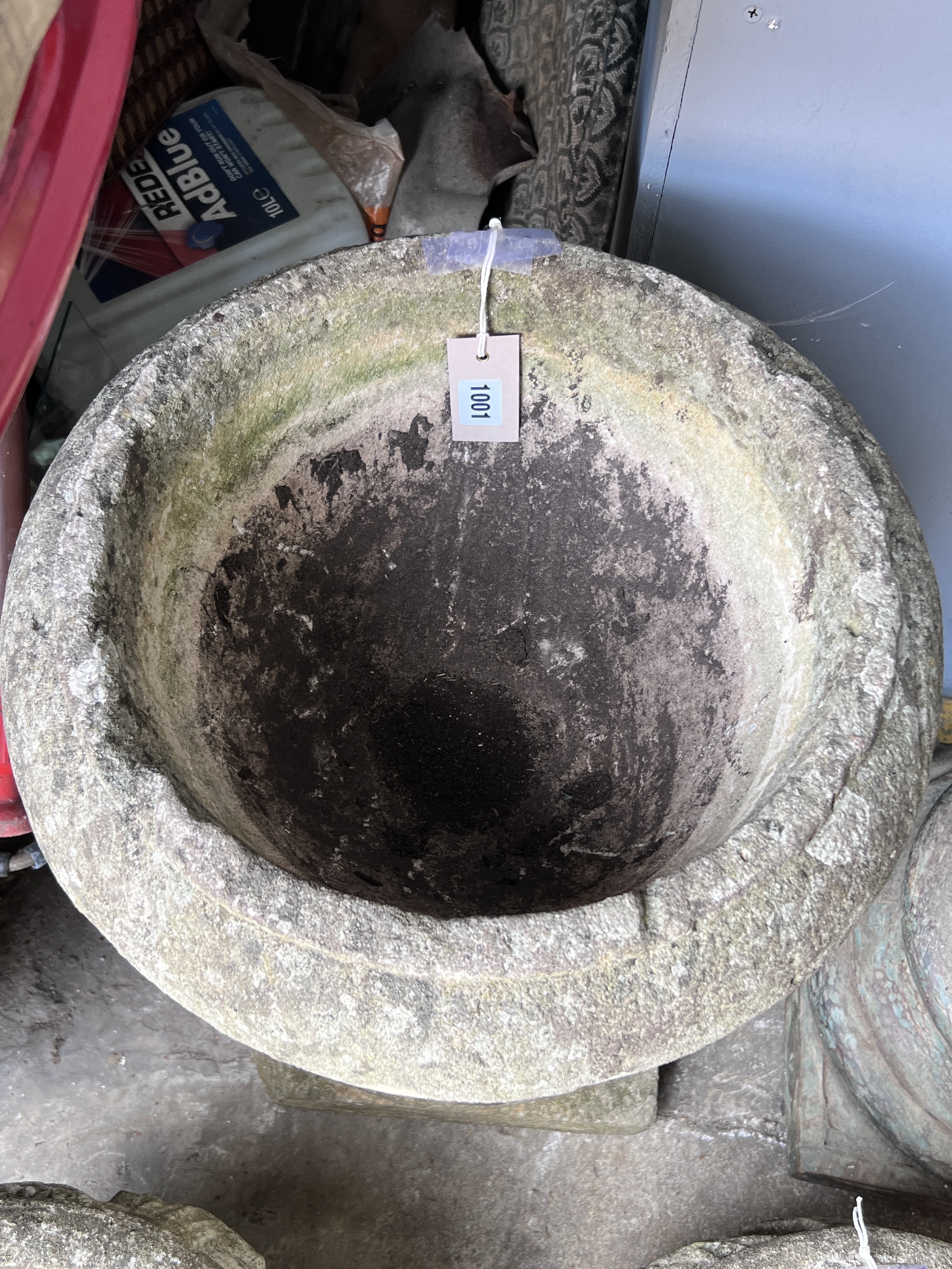 A circular reconstituted stone garden planter, diameter 40cm, height 62cm